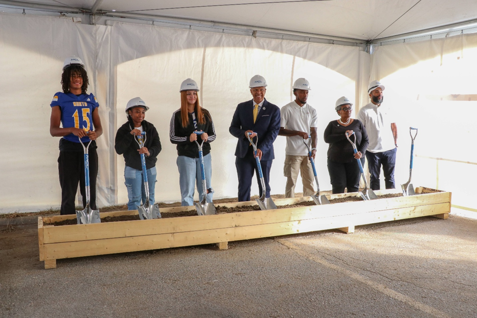 North High students and community leaders hold shovels at the Project Game ON groundbreaking ceremony